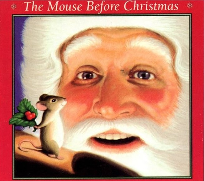 Book cover of The Mouse Before Christmas. Santa is looking at a mouse who standing on two legs and hold a piece of holly.