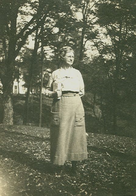 black and white photograph of Dr. Mary L. Cook in front of her house