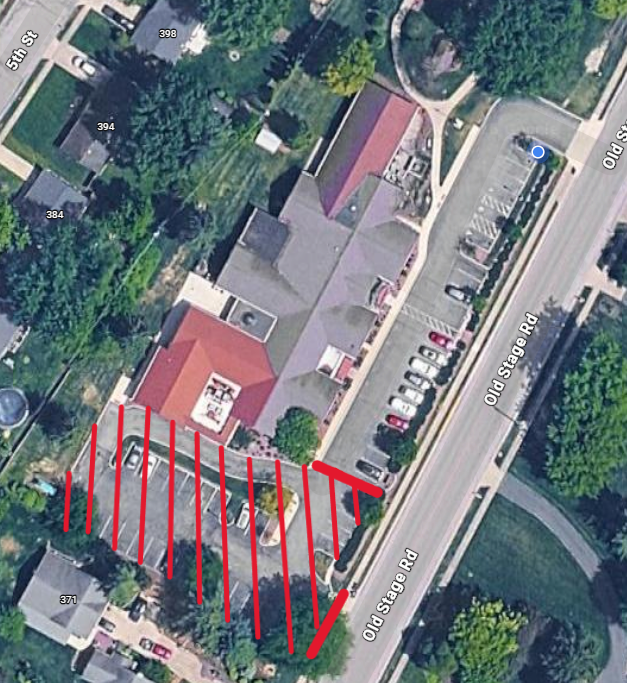 sky view of library with markings where the parking lot is closed.