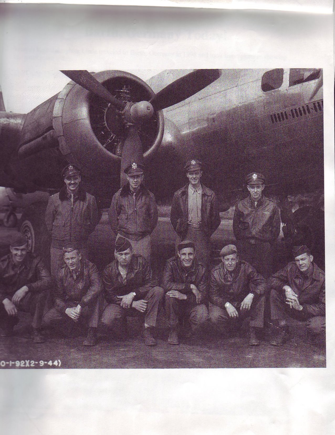 Ralph and other soldiers in front of an airplane