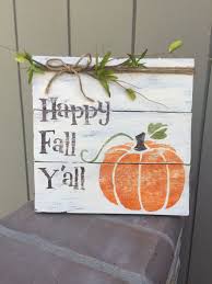 Wood sign with pumpkin says "Happy Fall Y'all"